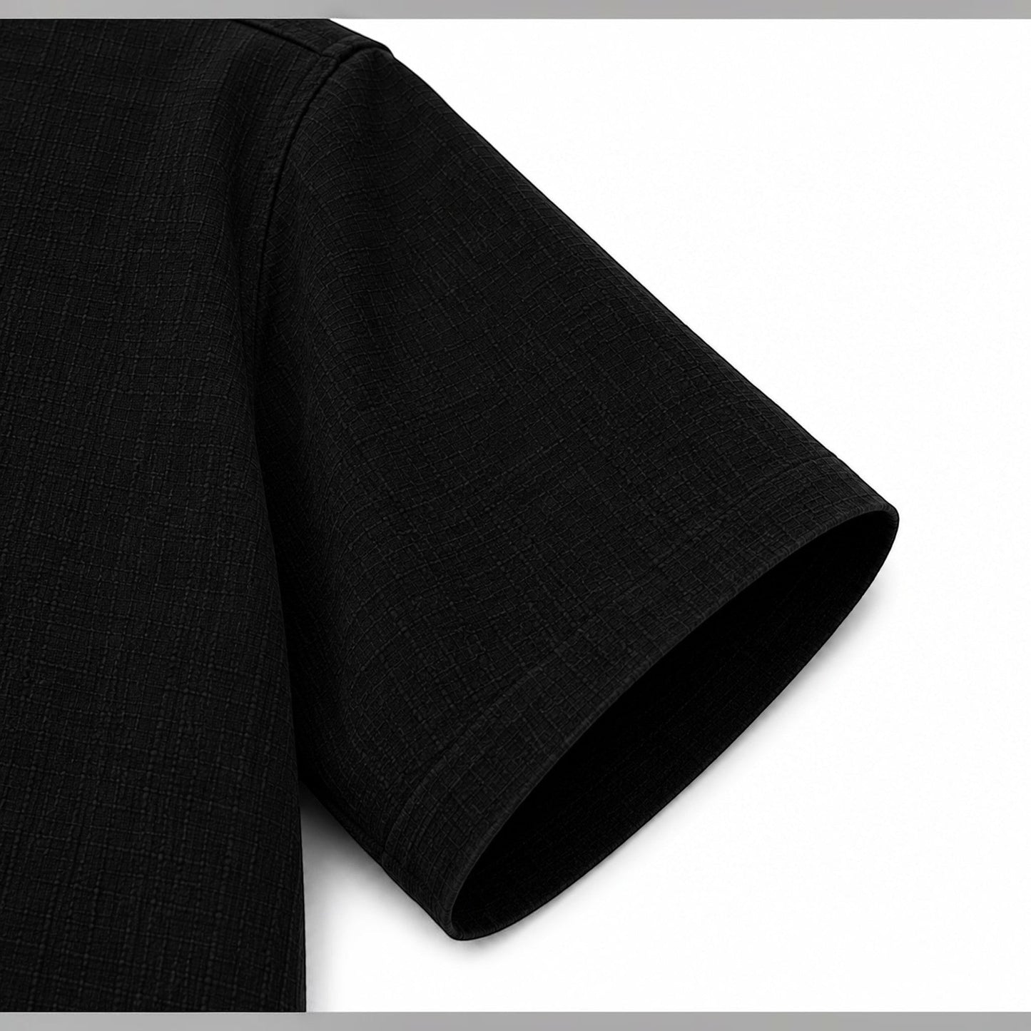 MU SHOP black linen short-sleeve shirt with a textured weave and relaxed fit.