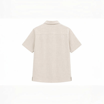 MU SHOP beige linen short-sleeve shirt with a soft collar and rounded hem. Relaxed fit.