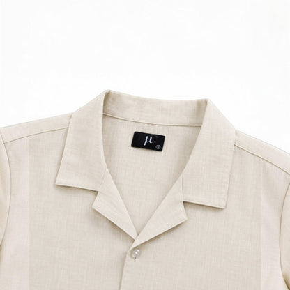 MU SHOP beige linen shirt with a soft structured collar and button closure. Relaxed fit, breathable fabric.