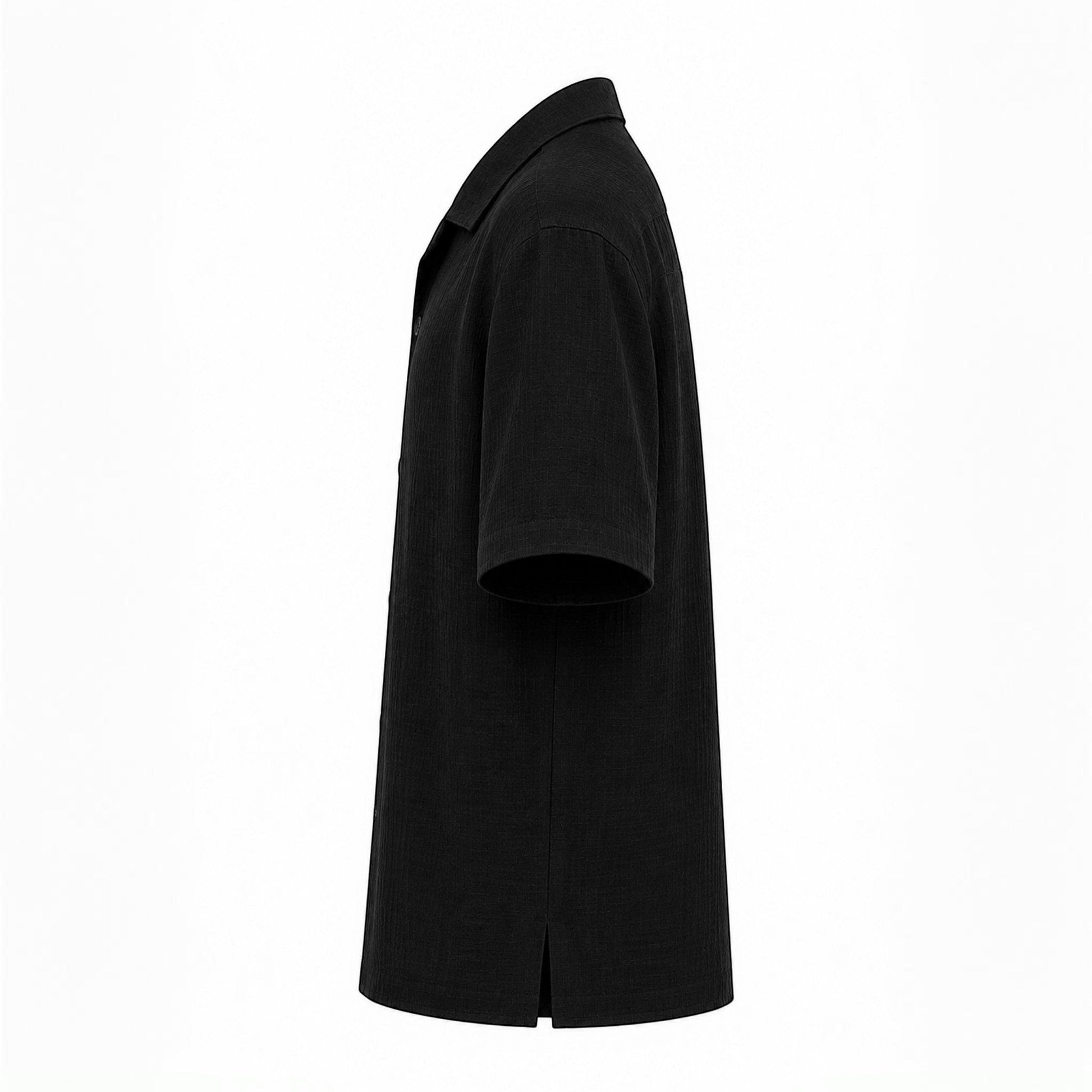 MU SHOP black linen short-sleeve shirt with a soft structured collar and matte buttons. Relaxed fit.