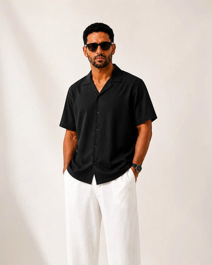 MU SHOP black linen short-sleeve shirt with a relaxed tailored fit and soft structured collar.
