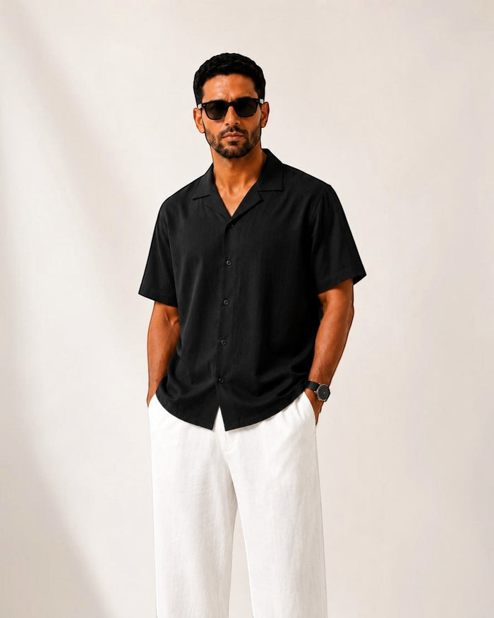 MU SHOP black linen short-sleeve shirt with a relaxed tailored fit and soft structured collar.