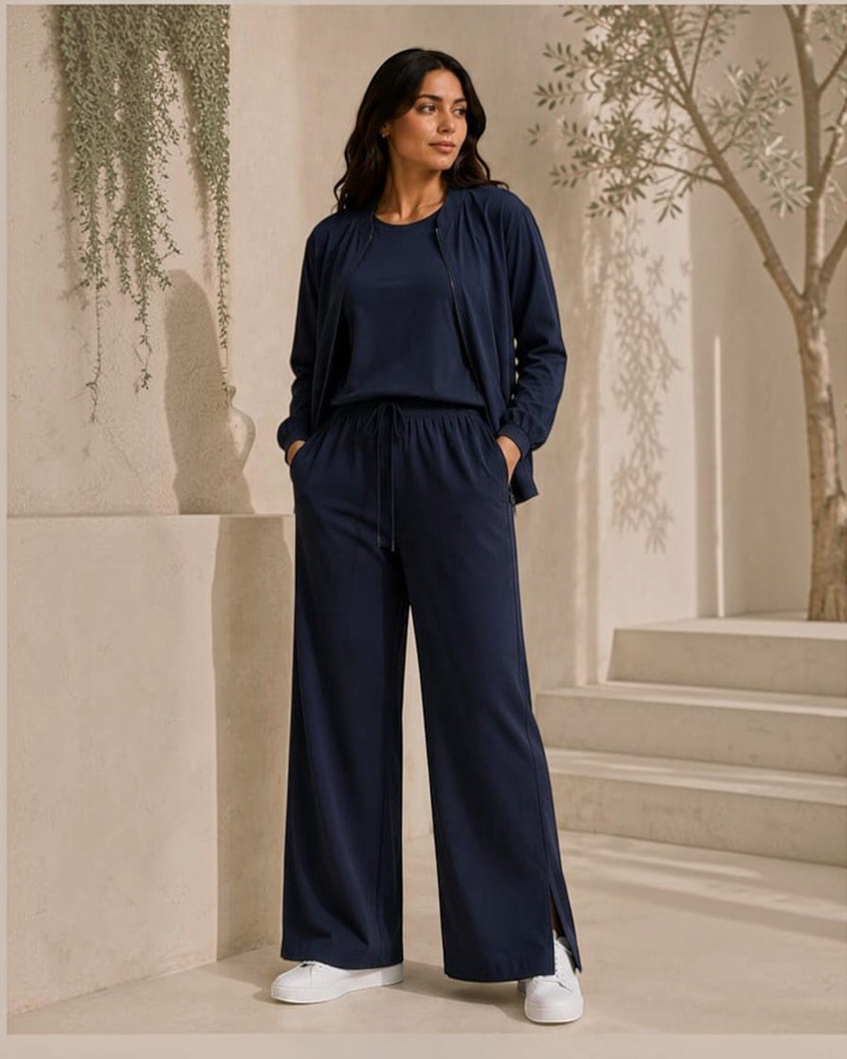 MU SHOP indigo three-piece set featuring a zip jacket, sleeveless top, and wide-leg trousers with side slits.