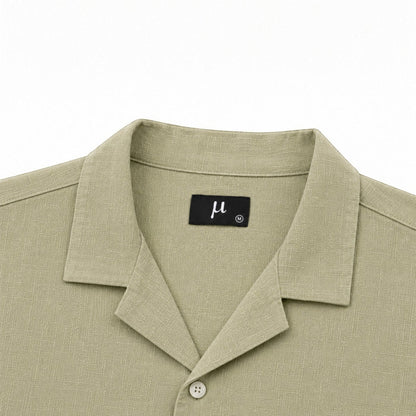MU SHOP olive green 100% linen short-sleeve shirt with a relaxed fit and spread collar.