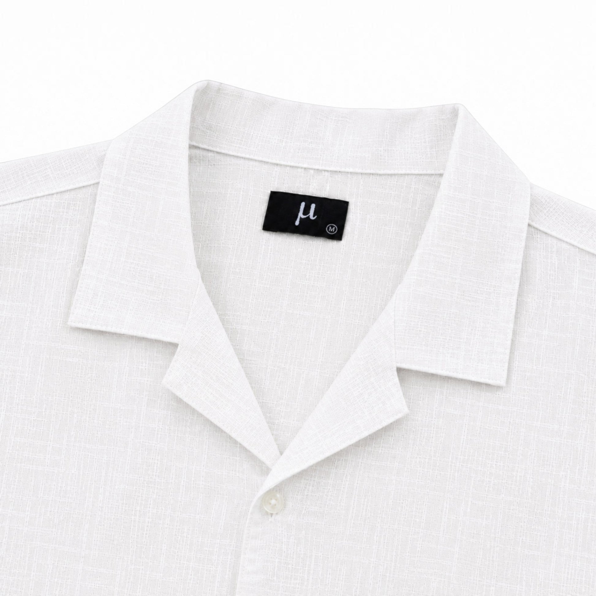 MU SHOP white linen shirt with a soft structured collar and relaxed fit. Premium breathable fabric.