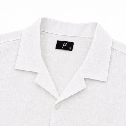 MU SHOP white linen shirt with a soft structured collar and relaxed fit. Premium breathable fabric.