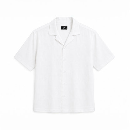MU SHOP white linen short-sleeve shirt with a relaxed fit and open collar, perfect for summer.
